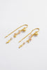 Poppy Thread Earring - Pastel-Zarla-A refined thread earring featuring soft pastel tones and delicate charms. Designed to move effortlessly with you, it catches the light with a subtle, beach-inspired elegance. Feminine, playful, and the perfect piece to elevate your everyday look. *18K Gold Plated Solid Brass *This piece is handmade and not recommended to be worn in water-Pash + Evolve