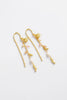 Poppy Thread Earring - Pastel-Zarla-A refined thread earring featuring soft pastel tones and delicate charms. Designed to move effortlessly with you, it catches the light with a subtle, beach-inspired elegance. Feminine, playful, and the perfect piece to elevate your everyday look. *18K Gold Plated Solid Brass *This piece is handmade and not recommended to be worn in water-Pash + Evolve
