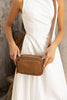Remi crossbody bag - Camel brown Pebble-Baleka Leather-Chic, compact & endlessly versatile. The Remi is our most versatile and practical bag - thoughtfully designed to keep up with your day. Featuring a front compartment for your must-have essentials, a sleek back pocket with secure press stud closure and a spacious main compartment complete with an internal zip pocket and slip pocket for a neat interior layout. Fully lined and finished with an adjustable strap that can be worn on the shoulder or crossbody,