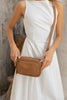 Remi crossbody bag - Camel brown Pebble-Baleka Leather-Chic, compact & endlessly versatile. The Remi is our most versatile and practical bag - thoughtfully designed to keep up with your day. Featuring a front compartment for your must-have essentials, a sleek back pocket with secure press stud closure and a spacious main compartment complete with an internal zip pocket and slip pocket for a neat interior layout. Fully lined and finished with an adjustable strap that can be worn on the shoulder or crossbody,