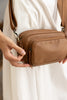Remi crossbody bag - Camel brown Pebble-Baleka Leather-Chic, compact & endlessly versatile. The Remi is our most versatile and practical bag - thoughtfully designed to keep up with your day. Featuring a front compartment for your must-have essentials, a sleek back pocket with secure press stud closure and a spacious main compartment complete with an internal zip pocket and slip pocket for a neat interior layout. Fully lined and finished with an adjustable strap that can be worn on the shoulder or crossbody,