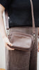 Remi crossbody bag - Chocolate Pebble-Baleka Leather-Chic, compact & endlessly versatile. The Remi is our most versatile and practical bag - thoughtfully designed to keep up with your day. Featuring a front compartment for your must-have essentials, a sleek back pocket with secure press stud closure and a spacious main compartment complete with an internal zip pocket and slip pocket for a neat interior layout. Fully lined and finished with an adjustable strap that can be worn on the shoulder or crossbody, 