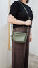 Remi crossbody bag - Olive Green Pebble-Baleka Leather-Chic, compact & endlessly versatile. The Remi is our most versatile and practical bag - thoughtfully designed to keep up with your day. Featuring a front compartment for your must-have essentials, a sleek back pocket with secure press stud closure and a spacious main compartment complete with an internal zip pocket and slip pocket for a neat interior layout. Fully lined and finished with an adjustable strap that can be worn on the shoulder or crossbody,