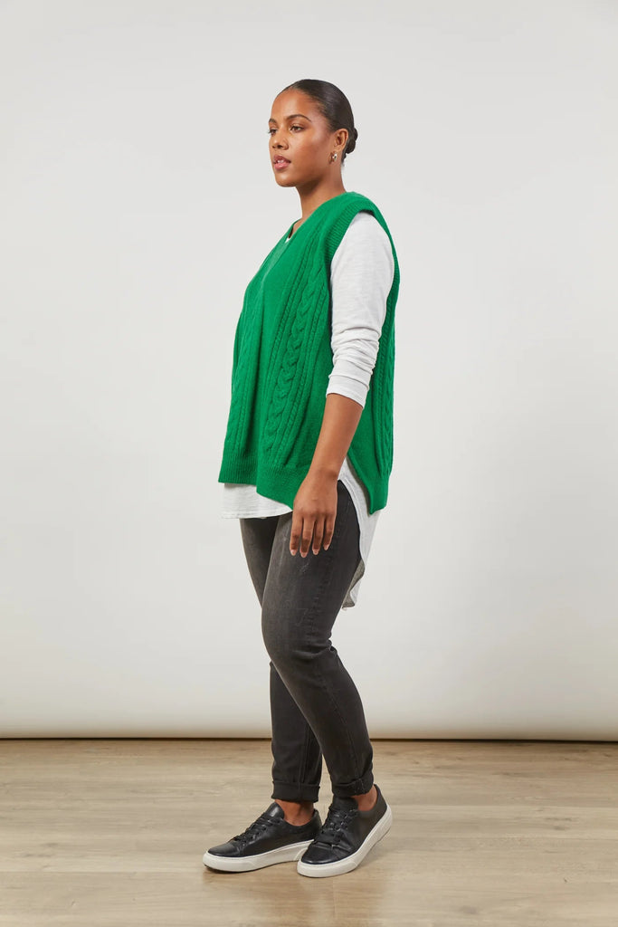 Renew Vest - Meadow-Isle of Mine-One vest. Endless possibilities. The oversized fit of the Renew Vest, crafted from a blend of wool and recycled knit, promises enduring versatility across seasons. With a v-neck, sleeveless design, and woven cable detailing, this vest effortlessly adds sophistication. Whether tucked into trousers or layered over a linen shirt, embrace the countless opportunities this vest brings for timeless and stylish ensembles. FEATURES: V-Neck Sleeveless Woven cable design Hip-length fit