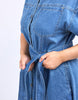 River Denim Dress - Mid Blue Wash-Elm-The River Denim Dress is a lovely long-line dress with a tie waist and button through shirt style dress that looks just as great worn with some comfy sneakers as it does teamed with a sandal or boot. Versatility is key with this dress. Shirt dress style with self fabric waist tie Panel details at skirt Side seam pockets Rigid Denim Model is 171cm and wears Size 10-Pash + Evolve