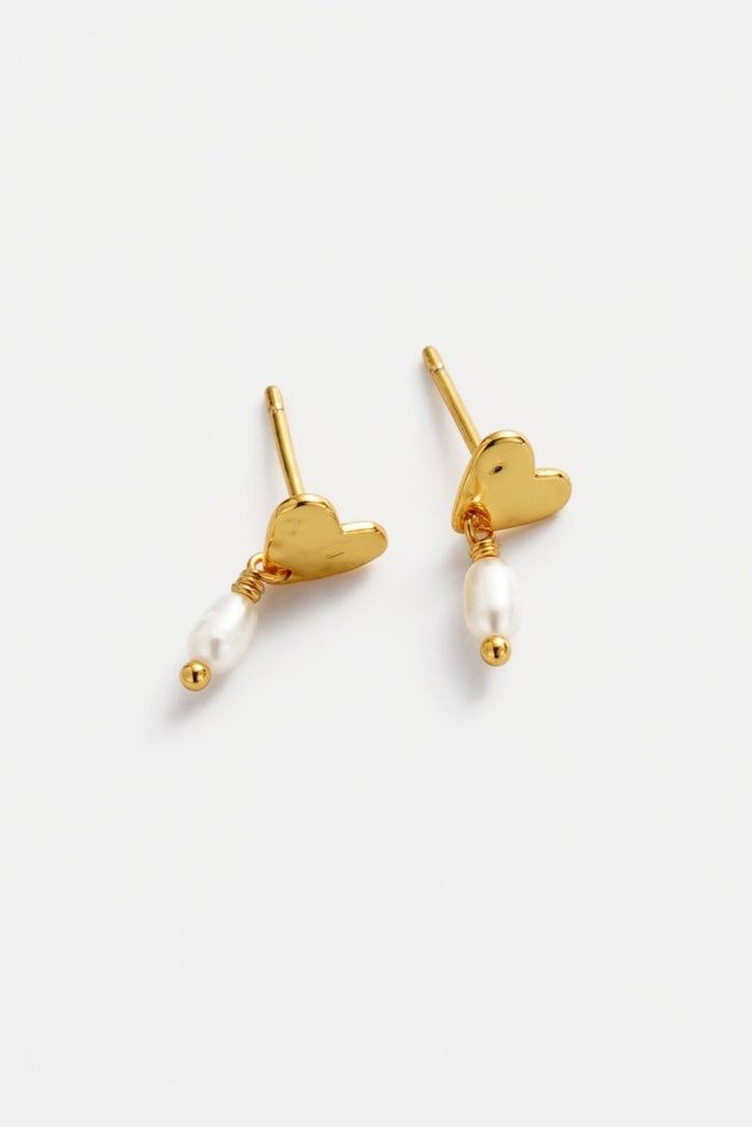 Romy drop earring - gold-Zarla-A softly sculpted gold heart, finished with a delicate pearl drop. This piece brings a sunlit, ocean-inspired feel with a touch of understated elegance. Effortless, feminine, and made for everyday wear. *18K Gold Plated Solid Brass Base *Water proof: Can be worn in the ocean or pool-Pash + Evolve