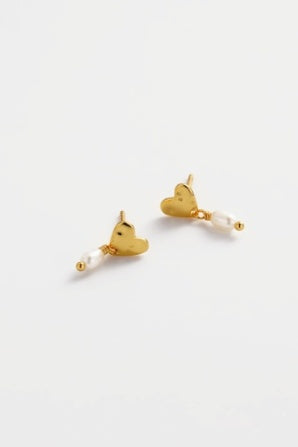 Romy drop earring - gold-Zarla-A softly sculpted gold heart, finished with a delicate pearl drop. This piece brings a sunlit, ocean-inspired feel with a touch of understated elegance. Effortless, feminine, and made for everyday wear. *18K Gold Plated Solid Brass Base *Water proof: Can be worn in the ocean or pool-Pash + Evolve
