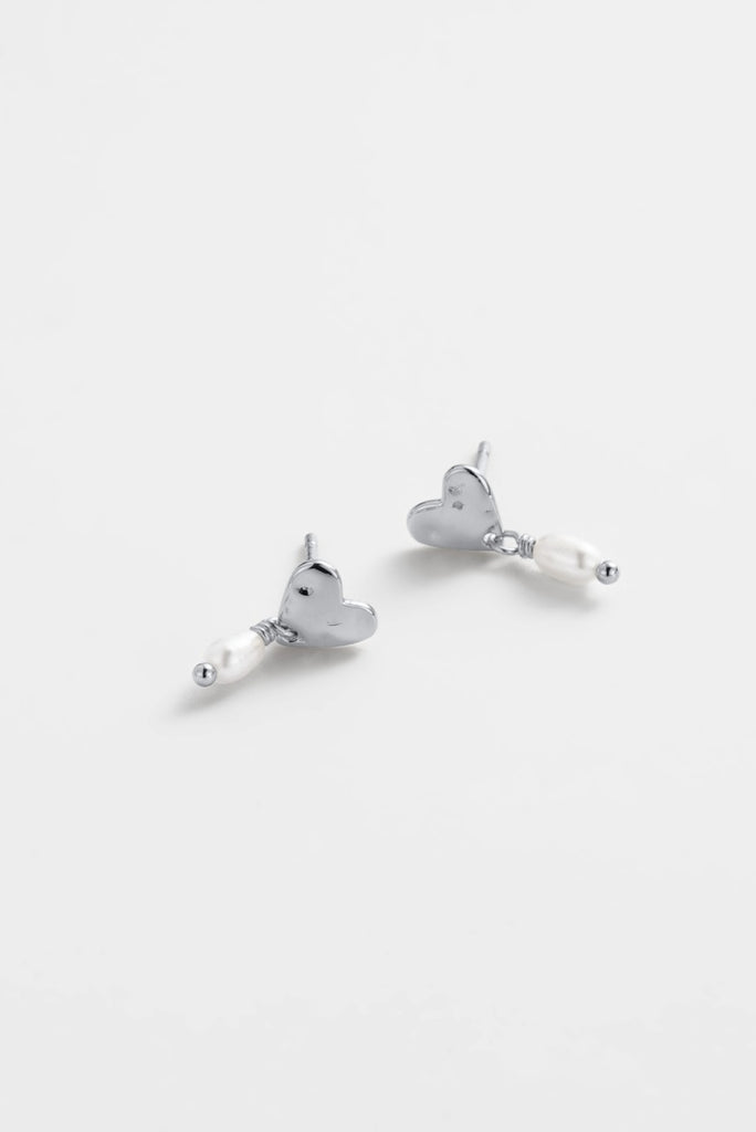 Romy drop earring - silver-Zarla-A softly sculpted silver heart, finished with a delicate pearl drop. This piece brings a light, coastal feel with a touch of understated elegance. Effortless, feminine, and made for everyday wear. *Rhodium Plated Solid Brass Base *Water proof: Can be worn in the ocean or pool-Pash + Evolve