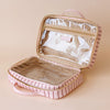 Rosé Pinstripe Cosmetic Bag-Fox & Fallow-The bag of your dreams is here! With so many bonus features, you’ll be wondering where they’ve been all your life. The miracle pop out bag everyone’s been talking about. The ingenious removable clear bag is the true MVP here: it pops out of the main bag and it’s perfect for all your makeup & skincare essentials so you can find them easily through the clear plastic sides. Take it out and use it for your daily makeup & skincare routine or separately at airport securit