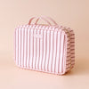 Rosé Pinstripe Cosmetic Bag-Fox & Fallow-The bag of your dreams is here! With so many bonus features, you’ll be wondering where they’ve been all your life. The miracle pop out bag everyone’s been talking about. The ingenious removable clear bag is the true MVP here: it pops out of the main bag and it’s perfect for all your makeup & skincare essentials so you can find them easily through the clear plastic sides. Take it out and use it for your daily makeup & skincare routine or separately at airport securit