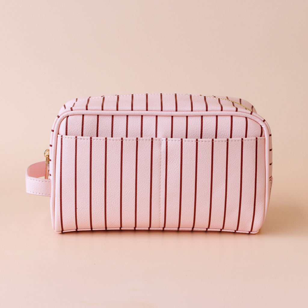 Rosè pinstripe wash bag-Fox & Fallow-The bag of your dreams is here! With so many bonus features, you’ll be wondering where they’ve been all your life. Beautiful, but practical. Perfect as an everyday make up bag or for all your bathroom essentials for the next work trip or vacay. Crafted from super soft, yet durable luxury pebble vegan leather it's easy to keep clean - simply wipe down with a damp cloth. The monogrammed tan lining is designed to hide make up or spills but also makes it easy to find all yo