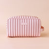 Rosè pinstripe wash bag-Fox & Fallow-The bag of your dreams is here! With so many bonus features, you’ll be wondering where they’ve been all your life. Beautiful, but practical. Perfect as an everyday make up bag or for all your bathroom essentials for the next work trip or vacay. Crafted from super soft, yet durable luxury pebble vegan leather it's easy to keep clean - simply wipe down with a damp cloth. The monogrammed tan lining is designed to hide make up or spills but also makes it easy to find all yo