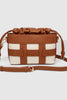 Roxi Crossbody Bag - Tan-Louenhide-The Louenhide Roxi Tan Crossbody Bag is a reliable companion that effortlessly complements any outfit. From your summer sundress to cozy winter ensembles, she’s the epitome of seasonal versatility. This bag isn't just an accessory; it’s a staple in your capsule wardrobe. Its drawstring closure and contrast woven detailing not only add texture-rich dimension, but elevate a minimalist's aesthetic, making it the perfect complement to your curated style. The compact bucket bag