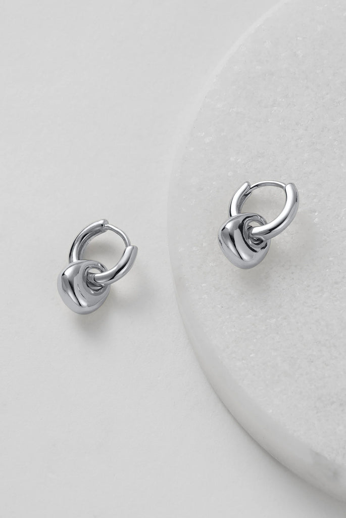 Sadie Hoop - Silver-Zafino-A dainty addition to your jewellery collection. These small hoops are adorned with a charming molten pendant, perfectly complementing the aesthetic of our Willow Necklace. Elevate your look with the understated elegance of the Sadie Hoop Earrings, designed to make a subtle yet stylish statement wherever you go. Metal: Silver Rhodium Plated on BrassDimensions: 8mm x 15mmWater Resistant: Splash proof, not recommended to be worn in the ocean or pool Water resistant Hypoallergenic & N