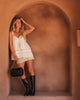 Saylor crossbody bag - black-Louenhide-The Louenhide Saylor Black Crossbody Bag brings a bold yet refined edge to your everyday styling. With its soft vegan leather finish and sleek baguette-shaped silhouette, this cross body bag with chain detailing blends texture and refinement in all the right ways. Designed to be worn with ease but styled to stand out, the Saylor Black moves effortlessly from day to night, adding impact to your layered winter looks. Wherever the day leads, this chain strap handbag is th