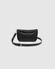Saylor crossbody bag - black-Louenhide-The Louenhide Saylor Black Crossbody Bag brings a bold yet refined edge to your everyday styling. With its soft vegan leather finish and sleek baguette-shaped silhouette, this cross body bag with chain detailing blends texture and refinement in all the right ways. Designed to be worn with ease but styled to stand out, the Saylor Black moves effortlessly from day to night, adding impact to your layered winter looks. Wherever the day leads, this chain strap handbag is th