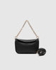 Saylor crossbody bag - black-Louenhide-The Louenhide Saylor Black Crossbody Bag brings a bold yet refined edge to your everyday styling. With its soft vegan leather finish and sleek baguette-shaped silhouette, this cross body bag with chain detailing blends texture and refinement in all the right ways. Designed to be worn with ease but styled to stand out, the Saylor Black moves effortlessly from day to night, adding impact to your layered winter looks. Wherever the day leads, this chain strap handbag is th