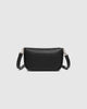 Saylor crossbody bag - black-Louenhide-The Louenhide Saylor Black Crossbody Bag brings a bold yet refined edge to your everyday styling. With its soft vegan leather finish and sleek baguette-shaped silhouette, this cross body bag with chain detailing blends texture and refinement in all the right ways. Designed to be worn with ease but styled to stand out, the Saylor Black moves effortlessly from day to night, adding impact to your layered winter looks. Wherever the day leads, this chain strap handbag is th