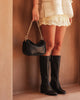 Saylor crossbody bag - black-Louenhide-The Louenhide Saylor Black Crossbody Bag brings a bold yet refined edge to your everyday styling. With its soft vegan leather finish and sleek baguette-shaped silhouette, this cross body bag with chain detailing blends texture and refinement in all the right ways. Designed to be worn with ease but styled to stand out, the Saylor Black moves effortlessly from day to night, adding impact to your layered winter looks. Wherever the day leads, this chain strap handbag is th