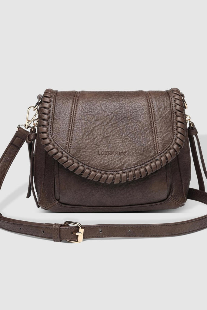 Shania Crossbody Bag - Chocolate-Louenhide-The Louenhide Shania Chocolate Crossbody Bag is the epitome of elevated style that complements your everyday ensemble. Available in a range of seasonal neutrals, this trending casual women's crossbody bag features a subtle woven vegan leather trim that adds a touch of effortless sophistication to your year-round capsule wardrobe. With a spacious and organised interior that fits your everyday essentials, you can keep your belongings safe with the magnetic clasp flap