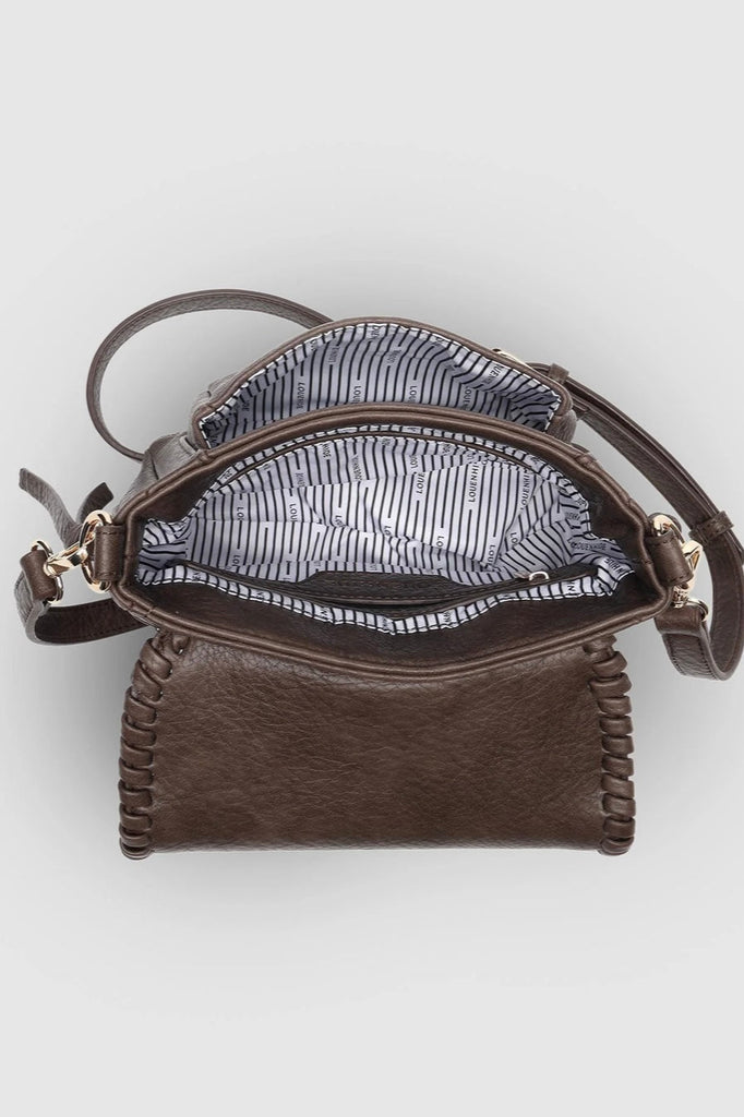 Shania Crossbody Bag - Chocolate-Louenhide-The Louenhide Shania Chocolate Crossbody Bag is the epitome of elevated style that complements your everyday ensemble. Available in a range of seasonal neutrals, this trending casual women's crossbody bag features a subtle woven vegan leather trim that adds a touch of effortless sophistication to your year-round capsule wardrobe. With a spacious and organised interior that fits your everyday essentials, you can keep your belongings safe with the magnetic clasp flap