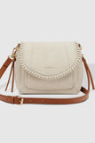Shania crossbody bag - Vanilla-Louenhide-The Louenhide Shania Crossbody Bag is the epitome of elevated style that complements any summer ensemble. Available in a range of timeless summer neutrals, this casual women’s crossbody bag features a subtle woven vegan leather trim that adds a touch of effortless sophistication to your summer capsule wardrobe. With a spacious and organised interior that fits your everyday essentials, you can keep your belongings safe with the magnetic clasp flap closure. With its so