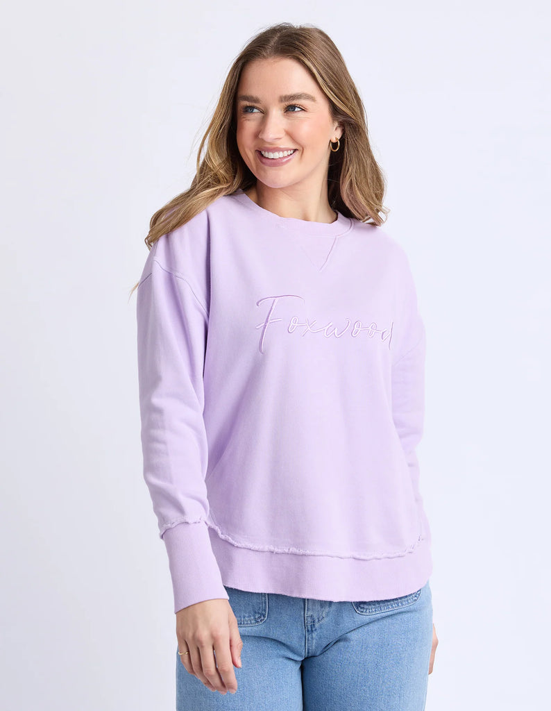 Signature Crew - Orchid-Foxwood-Our must-have Signature Crew is the perfect mix of comfort and style. Featuring classic Foxwood embroidery on the chest, this crew is all about the little details—think raw edge finishes and a flattering curved hemline. Designed for everyday ease, it’s your go-to layer for those laid-back, effortlessly cool looks. Front chest embroidery Raw edge detail Curved hem 100% Cotton Our model is 176cm and wears Size 10-Pash + Evolve