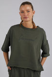 Signed Crew - Khaki-Foxwood-The new LeisureFit Signed Crew is bringing all the Flashdance vibes back to life in a comfort plus unbrushed grey merle elbow length fleece. This raw edged must have is simplicity plus yet brings all the style you need in your active lifestyle. 100% COTTON Model wears Size 10 and is 178cm tall-Pash + Evolve
