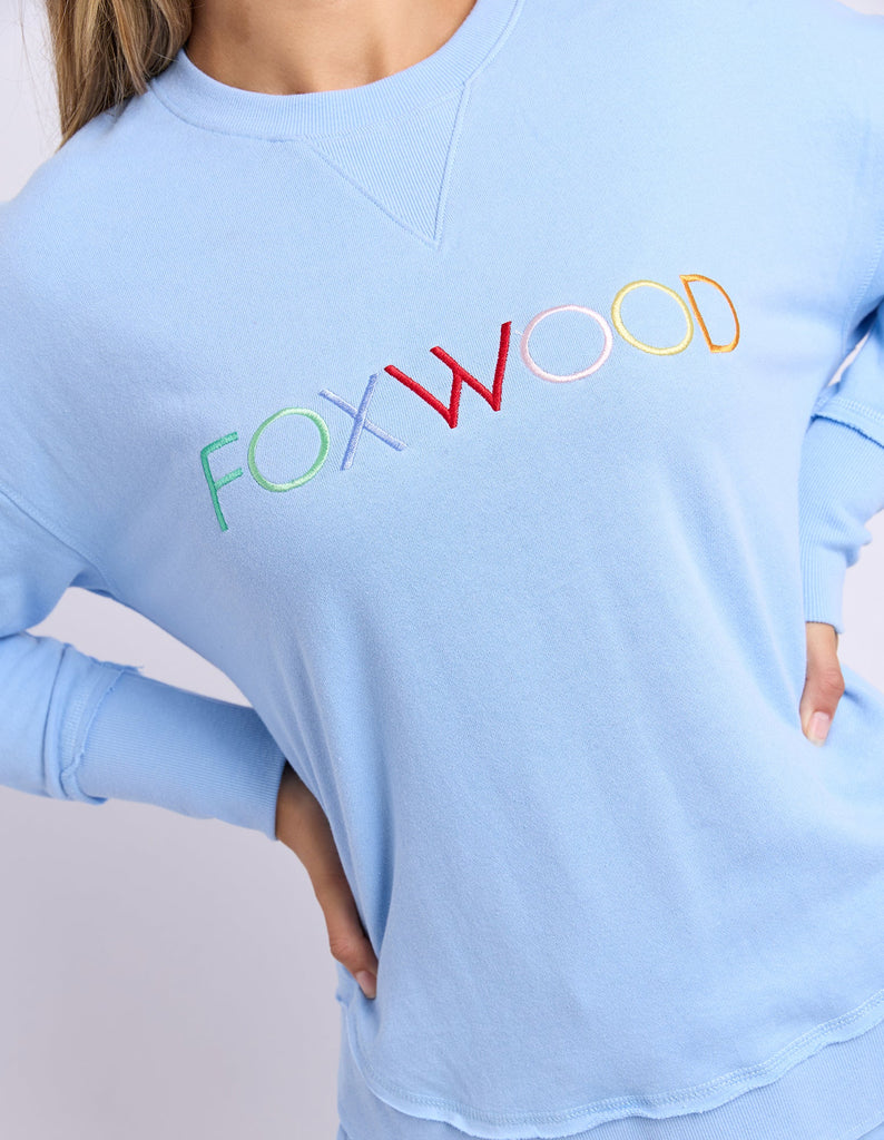 Simplified Confetti Crew - Bluebell-Foxwood-Say hello to your new feel-good fave. The Simplified Confetti Crew brings all the comfort with a playful twist. With multicoloured embroidery on the chest, raw edge details, and a curved hem that flatters every fit, it's the kind of piece you'll want to wear on repeat. Easy to throw on, even easier to love. One colour just won’t be enough. Front chest multicoloured embroidery Raw edge detail Curved hem 100% Cotton Our model is 176cm and wears Size 10-Pash + Evolv