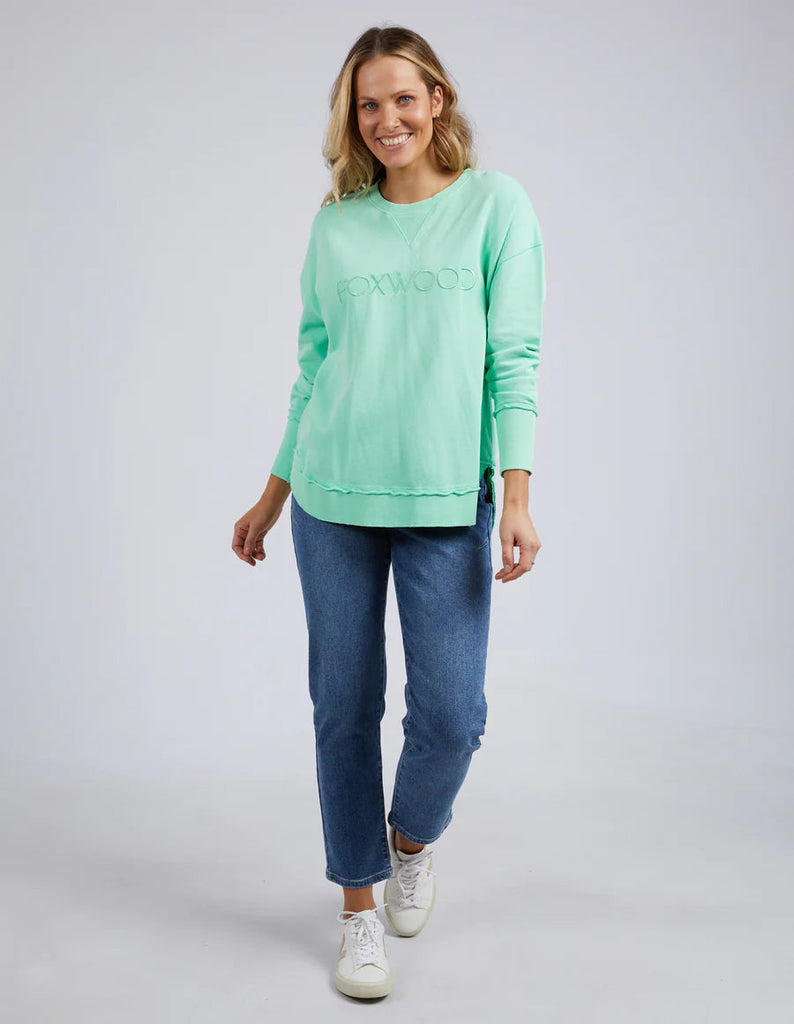 Simplified Crew Mint-Foxwood-The Simplified Crew is the perfect throw over for your everyday wardrobe. With its round neck, hi-lo hemline, side splits with raw edging & the classic Foxwood logo, you are going to want one in every colour. 100% UNBRUSHED COTTON FLEECE Our model wears size 10-Pash + Evolve