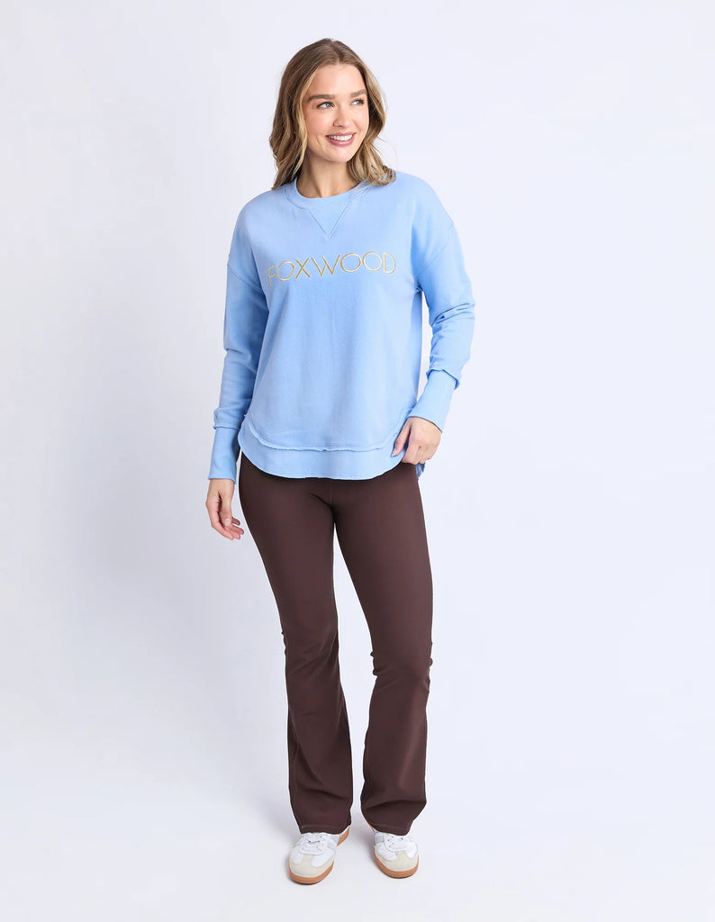 Simplified Metallic Crew - Blue/Lemon-Foxwood-The Bling version of our Best Selling Simplified Crew. This crew is the perfect throw over for your everyday wardrobe. With its round neck, hi-lo hemline, side splits with raw edging & the classic Foxwood logo, you are going to want one in every colour. The Metallic Crew has a stunning lurex thread run through the Foxwood embroidery for that little bit 'extra'. Front chest embroidery Raw edge detail Curved hem 100% Cotton Our model is 176cm and wears Size 10-Pa