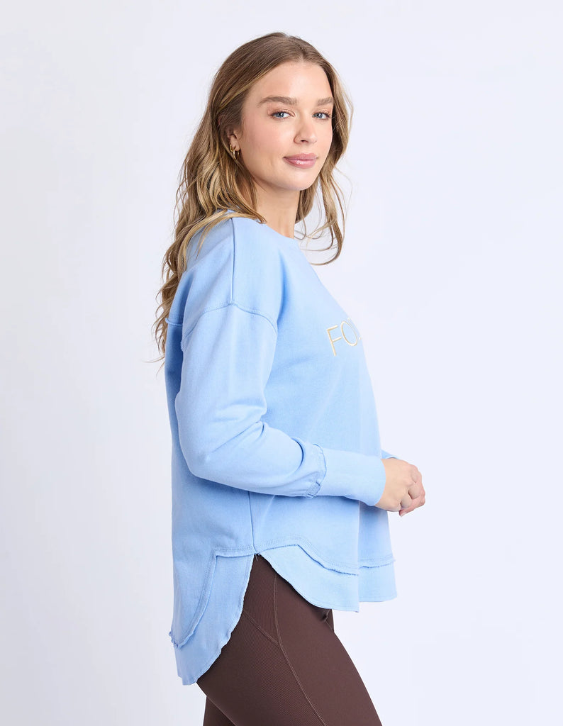 Simplified Metallic Crew - Blue/Lemon-Foxwood-The Bling version of our Best Selling Simplified Crew. This crew is the perfect throw over for your everyday wardrobe. With its round neck, hi-lo hemline, side splits with raw edging & the classic Foxwood logo, you are going to want one in every colour. The Metallic Crew has a stunning lurex thread run through the Foxwood embroidery for that little bit 'extra'. Front chest embroidery Raw edge detail Curved hem 100% Cotton Our model is 176cm and wears Size 10-Pa