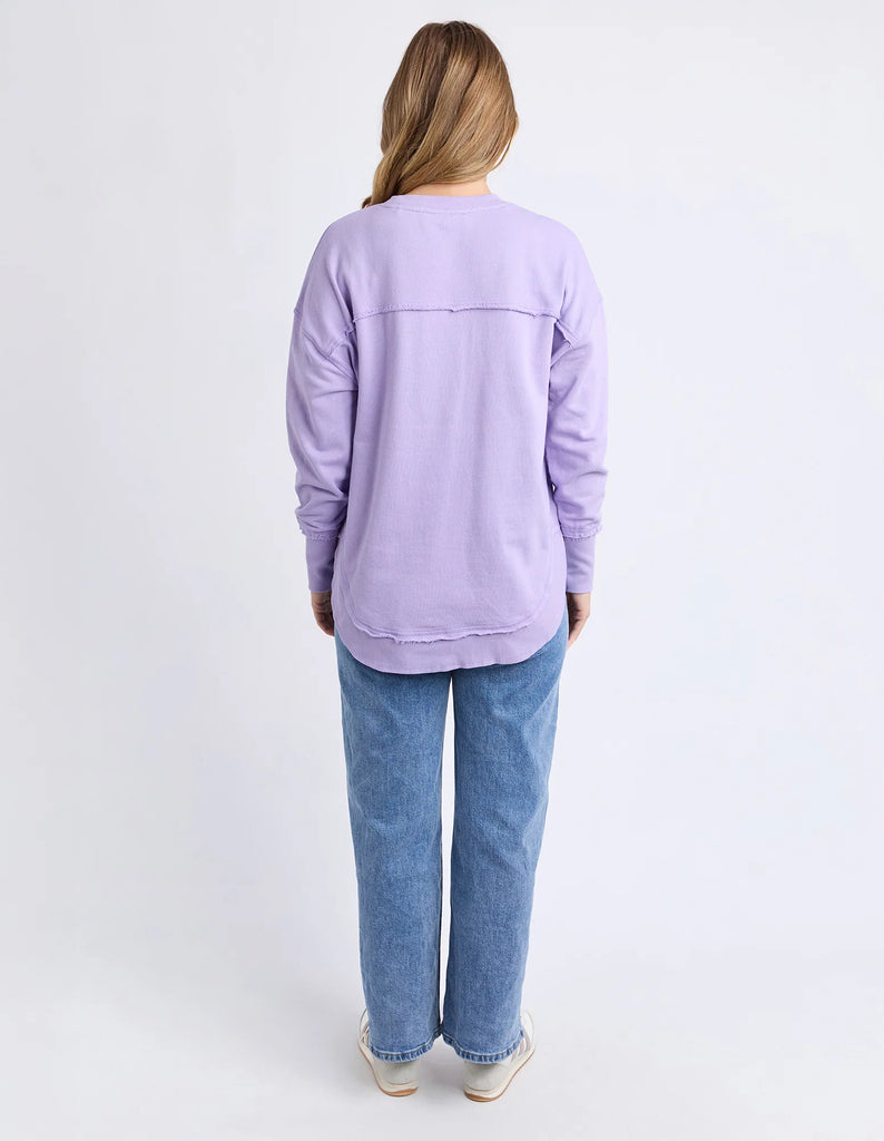 Simplified Metallic Crew - Lavender-Foxwood-The Bling version of our Best Selling Simplified Crew. This crew is the perfect throw over for your everyday wardrobe. With its round neck, hi-lo hemline, side splits with raw edging & the classic Foxwood logo, you are going to want one in every colour. The Metallic Crew has a stunning lurex thread run through the Foxwood embroidery for that little bit 'extra'. Front chest embroidery Raw edge detail Curved hem 100% Cotton Our model is 176cm and wears Size 10-Pash 