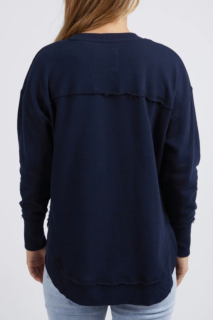 Simplified Metallic Crew - Navy-Foxwood-Say hello to our bling version! If you can't help yourself when it comes to a touch of glitz, then the Metallic Simplified Crew is the perfect addition to your everyday wardrobe. Its round neck, hi-lo hemline, side splits with raw edging and classic Foxwood logo will make you want one in every colour. Everyone loves this best selling crew from Foxwood Clothing. Round crew neckline Classic Foxwood chest logo in lurex metallic thread Side splits Raw edging on cuffs and 