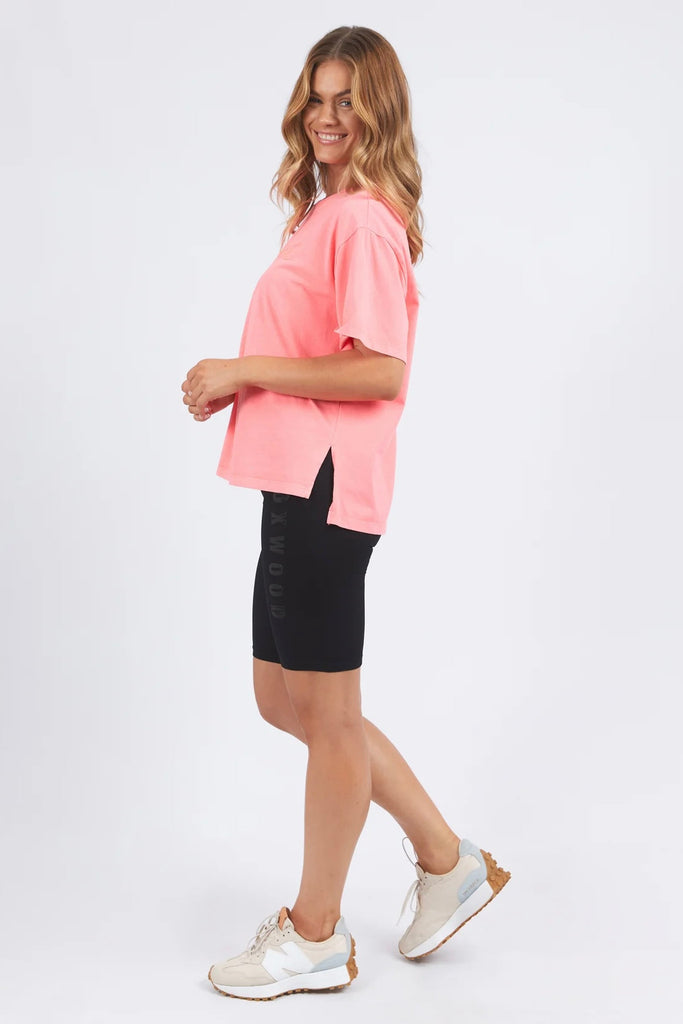 Simplified Tee - Neon Pink-Foxwood-The Simplified Tee is the perfect throw over for your everyday wardrobe. With its round neck, hi-lo hemline, side splits with raw edging & the classic Foxwood logo, you are going to want one in every colour. Front chest embroidery Round neckline Relaxed fit 100% Cotton Our model is 176cm and wears Size 10-Pash + Evolve