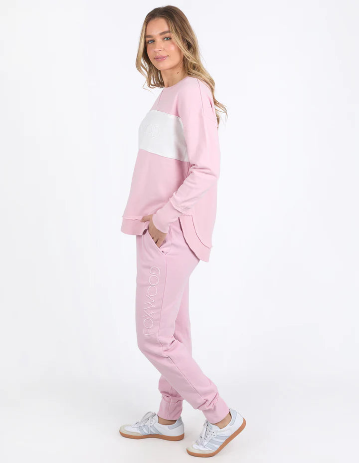 Simplified Tonal Crew - Blossom-Foxwood-Tonal dressing is the ultimate in versatility. For those who love a coordinated look that doesn't stray too far into colour, the tonal Simplified Crew is for you. Its round neck, hi-lo hemline, side splits with raw edging, and classic Foxwood logo insert into the tonal colour panel are tonal dressing perfection. Everyone loves this best-selling crew from Foxwood Clothing. Front chest embroidery Raw edge detail Contrast chest panel Unbrushed Cotton Fleece-Pash + Evolve