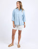Spire Shirt - Light Blue-Foxwood-Classic with a cool twist. The Spire Shirt features soft textured fabric, pintuck detailing, and a front placket opening with chest pockets for a laid-back yet polished look. Easy to style your way, whether layered, tucked in or worn loose. Front placket opening Pintuck detail Front chest pockets 100% Lyocell Model is wearing a size 10-Pash + Evolve