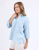 Spire Shirt - Light Blue-Foxwood-Classic with a cool twist. The Spire Shirt features soft textured fabric, pintuck detailing, and a front placket opening with chest pockets for a laid-back yet polished look. Easy to style your way, whether layered, tucked in or worn loose. Front placket opening Pintuck detail Front chest pockets 100% Lyocell Model is wearing a size 10-Pash + Evolve