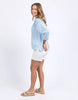Spire Shirt - Light Blue-Foxwood-Classic with a cool twist. The Spire Shirt features soft textured fabric, pintuck detailing, and a front placket opening with chest pockets for a laid-back yet polished look. Easy to style your way, whether layered, tucked in or worn loose. Front placket opening Pintuck detail Front chest pockets 100% Lyocell Model is wearing a size 10-Pash + Evolve