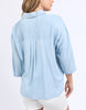 Spire Shirt - Light Blue-Foxwood-Classic with a cool twist. The Spire Shirt features soft textured fabric, pintuck detailing, and a front placket opening with chest pockets for a laid-back yet polished look. Easy to style your way, whether layered, tucked in or worn loose. Front placket opening Pintuck detail Front chest pockets 100% Lyocell Model is wearing a size 10-Pash + Evolve