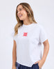 Stamp Tee - White-Foxwood-Give your look a twist with the Stamp Tee. Featuring raw edge detailing that’s all about laid-back cool. It’s the perfect little rough-around-the-edges touch that adds personality and keeps things fresh. Front chest embroidery Round neckline Raw edge detail 100% Cotton Model is wearing a size 10-Pash + Evolve
