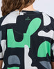 Stijl tee - abstract-Elm-Redefine comfort and chic with the Stijl Tee a fresh take on gorgeous geometric designs. Every wardrobe deserves a little fun – and this brings it. Exclusive Elm print Drop shoulder 100% Cotton Model is wearing a size 10-Pash + Evolve