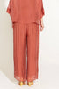 Sunlight And Shadow High-Waisted Silk Wide Leg Pant - Burnt Rose-FATE + BECKER-Drape yourself in opulence with our Sunshine and Shadow Silk Pant � a masterpiece in relaxed sophistication. The wide-leg silhouette exudes timeless elegance, while the jersey waistband ensures luxurious comfort. Elevate your style effortlessly with these silk pants, where comfort meets couture in perfect harmony. Shine bright in the Sunshine and Shadow collection a celebration of refined fashion. -Relaxed Fit -Wide Leg -Jersey C