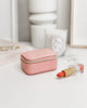 Suzie jewellery box - pink-Louenhide-The Louenhide Suzie Pink Jewellery Box is a sweet travel companion ready to store all of your rings, necklaces, bracelets, and earrings. Use every day and stow in your bag for on-the-go use, or pack for weekend adventures. Featuring three ring rolls, two compartments, and an elasticated slip pocket, your precious gems will be secured safely. Internal Features 2 Ring Rolls, Elastic Slip Pocket, 2 Compartments Internal Lining Faux Suede 100% Lining Closure Secure Zip Body 