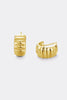 Tess earring - gold-Zafino-The Tess Earring in gold is a chunky, sculptural take on the classic huggie. Featuring a ribbed, fluted design with a bold, rounded silhouette, it adds tactile texture and dimension to any ear. The polished gold finish catches the light beautifully, creating subtle highlights along each groove. A versatile piece that adds effortless statement style to your everyday look. Brass / 18K Gold Plating 14.5mm outer diameter, 10mm inner diameter + 7.7mm width Water proof: Can be worn in 