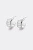 Tess earring - silver-Zafino-The Tess Earring in silver is a chunky, sculptural take on the classic huggie. Featuring a ribbed, fluted design with a bold, rounded silhouette, it adds tactile texture and dimension to any ear. The polished silver finish catches the light beautifully, creating subtle highlights along each groove. A versatile piece that adds effortless statement style to your everyday look. Brass / Silver Plating 14.5mm outer diameter, 10mm inner diameter + 7.7mm width Water proof: Can be worn