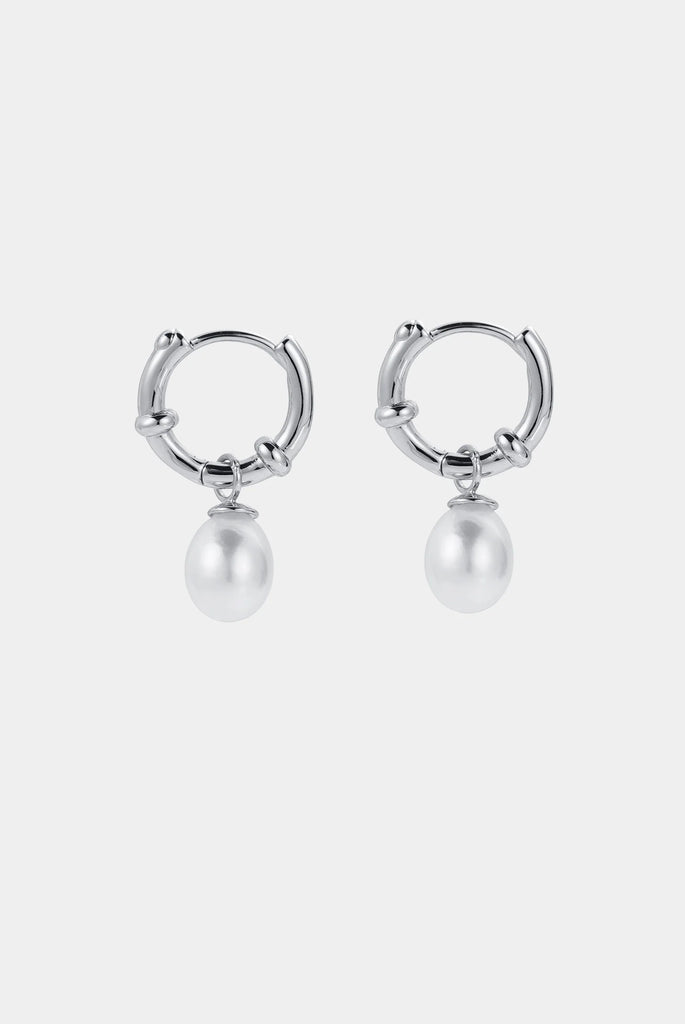 Tessa Pearl hoop - Silver-Zafino-The Tessa Hoop is a modern take on classic pearl earrings, featuring a polished gold hoop paired with a softly shaped freshwater pearl drop. The clean silhouette makes this piece effortlessly versatile — refined enough for events yet minimal enough for everyday wear. Lightweight and timeless, Tessa adds subtle movement and elegance to any look. Wear alone for understated polish or stack with other hoops and huggies for a layered ear moment. An elevated everyday essential des