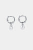 Tessa Pearl hoop - Silver-Zafino-The Tessa Hoop is a modern take on classic pearl earrings, featuring a polished gold hoop paired with a softly shaped freshwater pearl drop. The clean silhouette makes this piece effortlessly versatile — refined enough for events yet minimal enough for everyday wear. Lightweight and timeless, Tessa adds subtle movement and elegance to any look. Wear alone for understated polish or stack with other hoops and huggies for a layered ear moment. An elevated everyday essential des