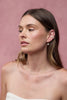 Tessa pearl hoop - gold-Zafino-The Tessa Hoop is a modern take on classic pearl earrings, featuring a polished gold hoop paired with a softly shaped freshwater pearl drop. The clean silhouette makes this piece effortlessly versatile — refined enough for events yet minimal enough for everyday wear. Lightweight and timeless, Tessa adds subtle movement and elegance to any look. Wear alone for understated polish or stack with other hoops and huggies for a layered ear moment. An elevated everyday essential desig