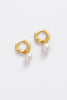 Tessa pearl hoop - gold-Zafino-The Tessa Hoop is a modern take on classic pearl earrings, featuring a polished gold hoop paired with a softly shaped freshwater pearl drop. The clean silhouette makes this piece effortlessly versatile — refined enough for events yet minimal enough for everyday wear. Lightweight and timeless, Tessa adds subtle movement and elegance to any look. Wear alone for understated polish or stack with other hoops and huggies for a layered ear moment. An elevated everyday essential desig